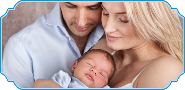 Parents cradling their sleeping newborn